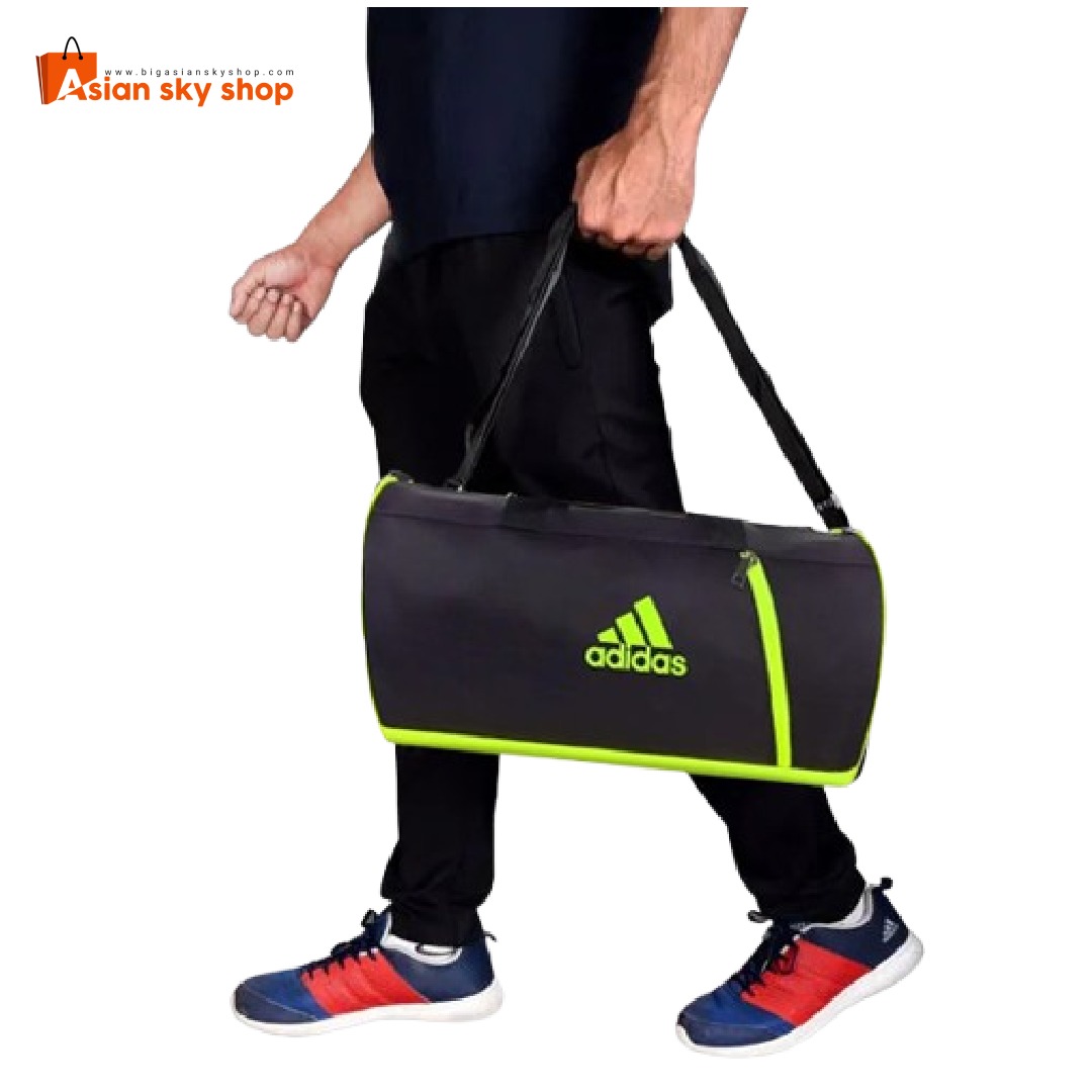 Person carrying Adidas Gym Bag 16 Inch with gym essentials in the shoe compartment